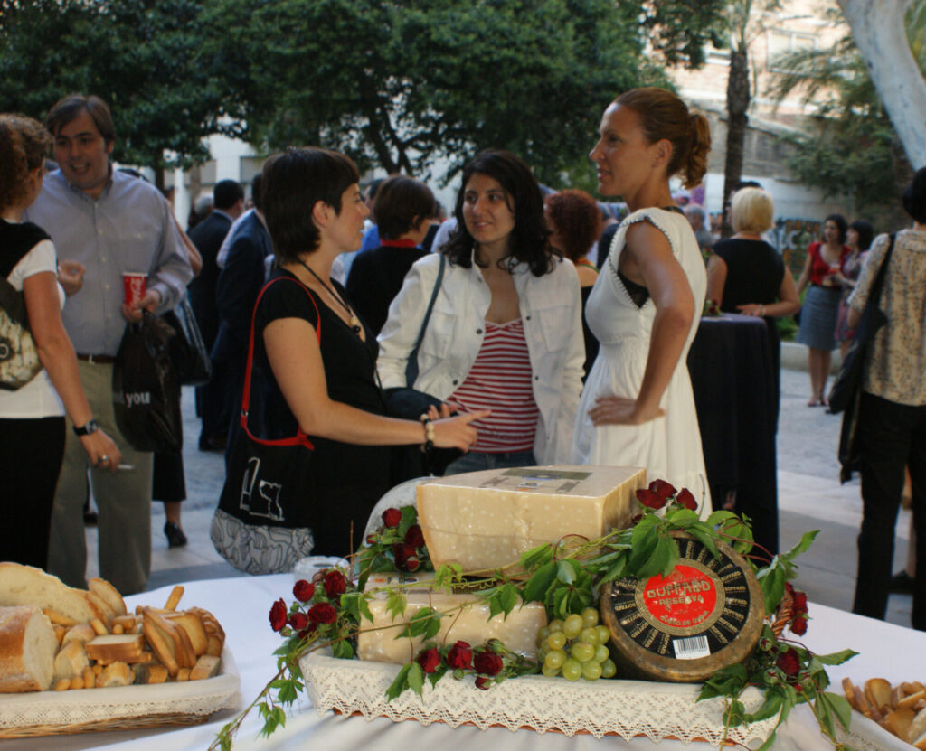 Guests talking over cheese and roses at the Gradium 2009 evening