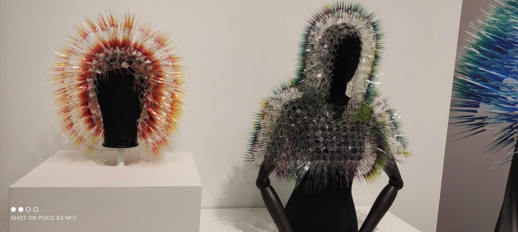 Feathered and spiked headpieces, Fashion Fictions, Vancouver Art Gallery